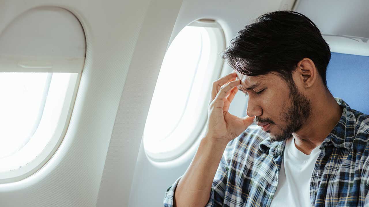 Frustrated passenger on flight having a poor customer experience